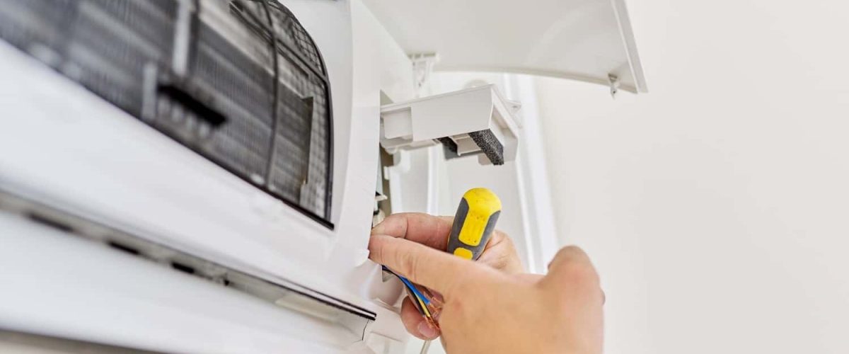 installing-an-air-conditioner-in-an-apartment-offi-2021-12-09-22-09-41-utc-min-min.jpg